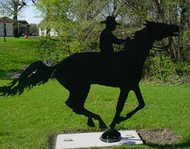 Oscar Sorbel riding toward Madelia - Jesse James Theme Park