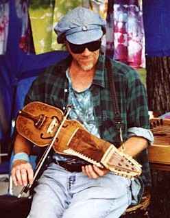 Tom Playing a Nyckelharpa. Photo by Joel Jackson